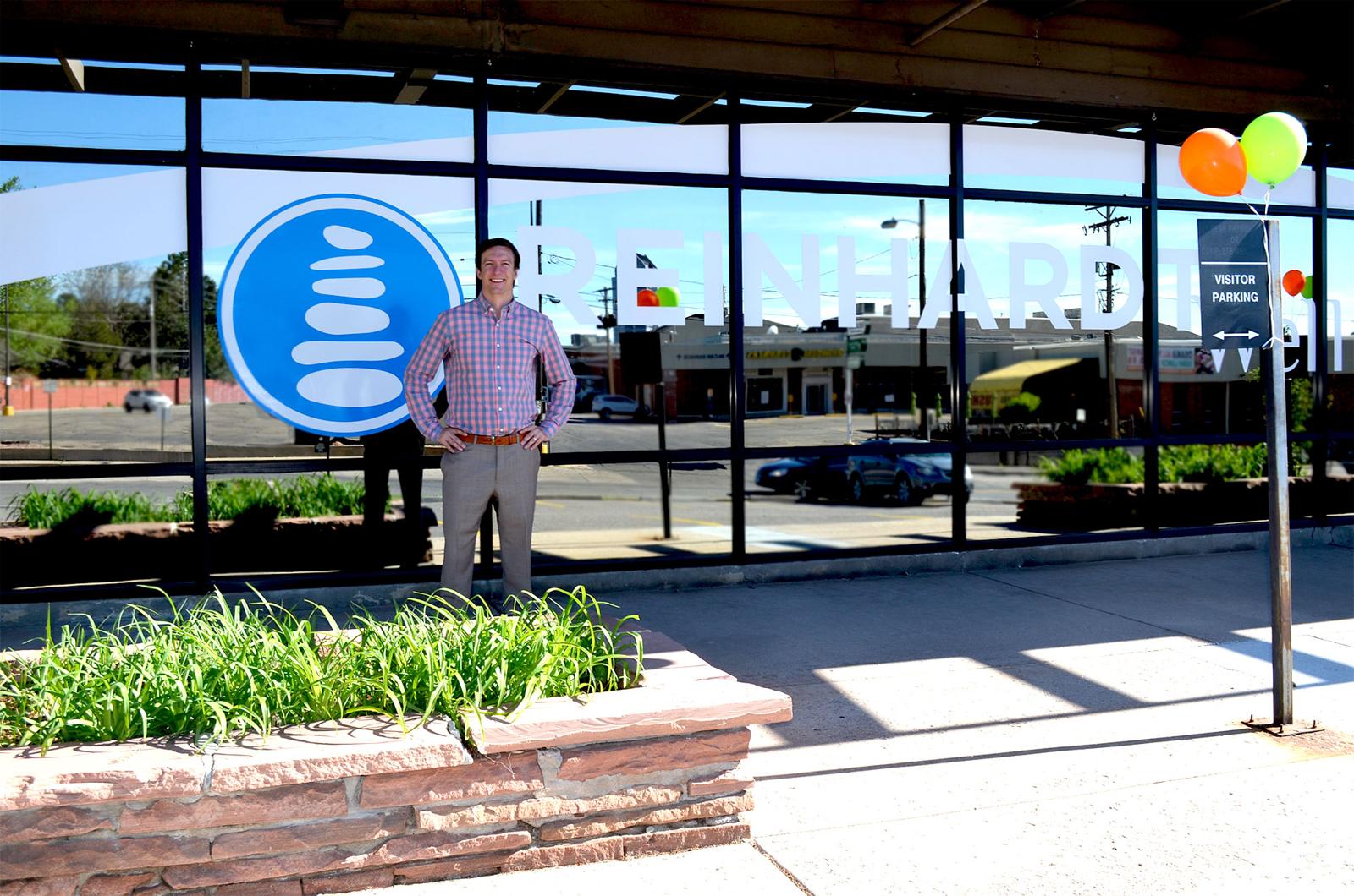 Dr. Graham Reinhardt standing in front of his clinic